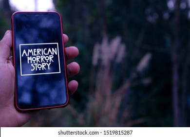 United States New York. Tuesday, October 1, 2019, Hand Holding Iphone 11 Pro With The American Horror Story Logo. American Horror Story Is A Drama And Horror Television Series.