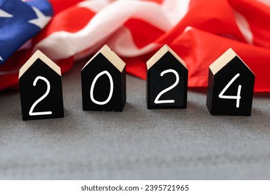 United States presidential election 2024. Wooden cubes with the letters 2024 on the American flag background. Politics and voting conceptual