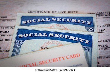 United States Social Security cards with birth certificate background. Concept for life, retirement or death or Government documents and identification. 