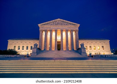 United States Supreme Courts Building Illuminated At Night In Washington DC With Steps And Plaza In Foreground