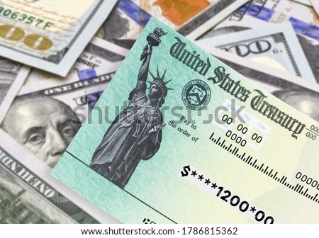 United States Treasury check, ssn card with US currency. Coronavirus economic impact stimulus payments or IRS tax refund on isolated background 