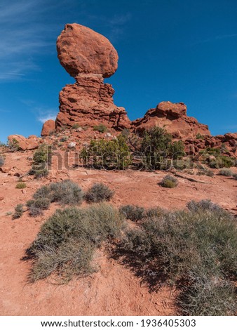 United States. Utah. Arches National Park. Balanced Rock. Its height is about 128 feet (39 m), with a balancing rock rising 55 feet (16.75 m) above the base. 

