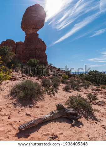 United States. Utah. Arches National Park. Balanced Rock. Its height is about 128 feet (39 m), with a balancing rock rising 55 feet (16.75 m) above the base. 
