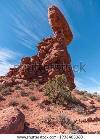 United States. Utah. Arches National Park. Balanced Rock. Its height is about 128 feet (39 m), with a balancing rock rising 55 feet (16.75 m) above the base. 

