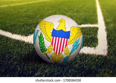 United States Virgin Islands flag on ball at corner kick position, soccer field background. National football theme on green grass. - Powered by Shutterstock