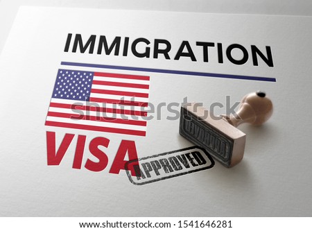 United States Visa Approved with Rubber Stamp and  American flag
