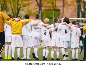 United Youth Sports Team. Football Soccer Teen Players Standing Together with Coach During Penalty Kicks. Boys in White Soccer Jersey Sportswear - Powered by Shutterstock