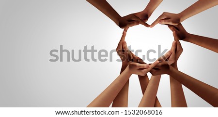 Unity and diversity partnership as heart hands in a group of diverse people connected together shaped as a support symbol expressing the feeling of teamwork and togetherness.