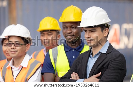 Unity and success concept.Bottom view of Engineer team people standing hands holding together at the container yard.