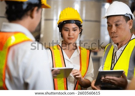 Unity and teamwork. Asian team engineer worker working control sheet metal roof tile roll forming machine at metal sheet profiling factory. Industrial production