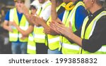 Unity and teamwork concept. team standing hands together. Professional Mechanical Engineer team Working at Second-hand spare parts of old car parts warehouse store. Celebrate clapping