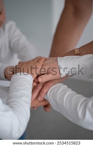 Unity, teamwork, support, togetherness, connection, hands, trust, collaboration, harmony, solidarity, friendship, strength, bond, cooperation, care, kindness,helping, peace, tragement, belonging.
