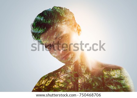 Unity with yourself. Glamorous charming guy looking at the camera and tilting his head posing on the very background