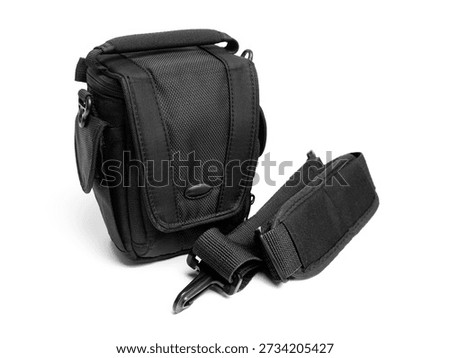 A universal black camera bag with padding and multiple pockets. Perfect for product advertising, lifestyle photography, and camera equipment storage concepts.
