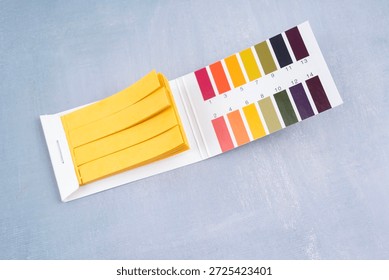 Universal indicator paper with acidic testing, Flat lay.