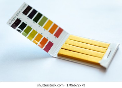 Universal Litmus PH Test And Color Scale On White Background