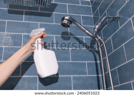 Universal Multi Function Hand Shower with Limescale, Chalky White Deposit in Focus, White Blank Plastic Spray Bottle in Human Hand In Bathroom. Packaging, Hygiene Mockup. Horizontal. Sanitary.