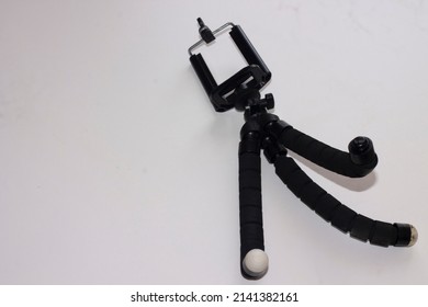 Universal smart phone tripod isolated on the white background. 