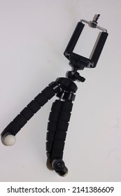 Universal smart phone tripod isolated on the white background. 