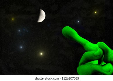 Universe - Green Alien Hand With Outstretched Finger Pointing To The Moon And The Stars