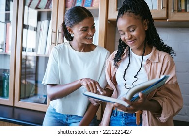 University, Book And Students In Library Teamwork In Education, Learning And School Scholarship Discussion. Studying College Women And Friends Conversation, Communication And Collaboration Together