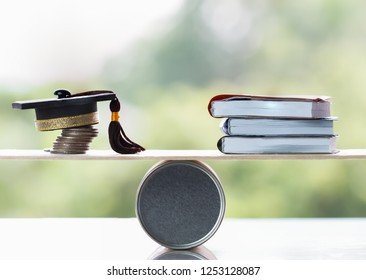 University Education learning abroad international Ideas. Student Graduation cap on stack coins, books on wood round box balance. Concept of study requires cost money saving for success in school