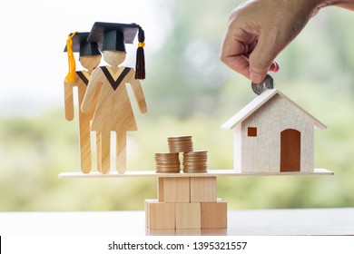 University Education learning abroad international Idea. Student Graduation save coins in house on wood balance. Concept of study requires money cost saving, may be home loan transform propery to cash