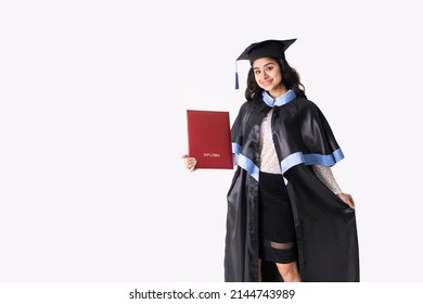 University graduate indian race woman wearing academic regalia and red diploma isolated. - Shutterstock ID 2144743989