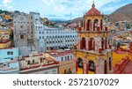 The University of Guanajuato from an aerial shot at sunset. You can also see its churches, plazas and the tourist icons of this colonial city.