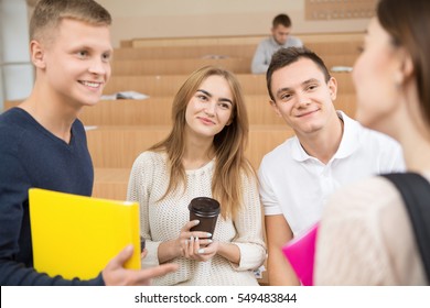 University Life. Group Of Cheerful College Friends Talking In Classroom Before The Lecture Education Together Friends Classmates Happiness University Friendship Communication Talk People Concept