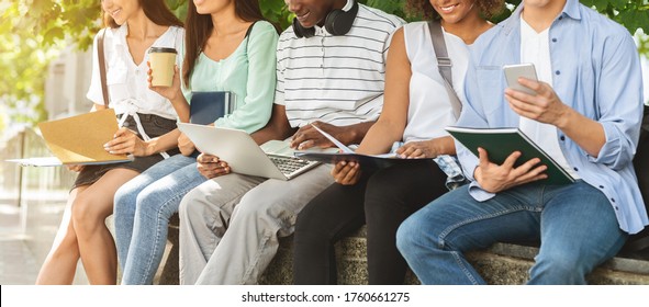 University Life. Students Preparing For Lessons, Sitting In Campus With Books And Devices, Cropped Image, Panorama