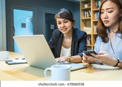 University Master Degree Student Do A Group Report Homework With Laptop In A University Library, Library University's Student Concept