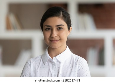 University Or School Teacher, Business Lady Had Shot Portrait Concept. Young Attractive Indian Ethnicity Woman In White Shirt Pose In Library Room With Bookshelves On Background Smile Look At Camera