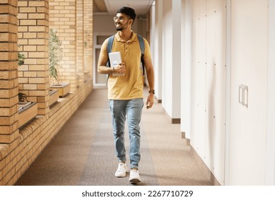 University student, college and indian man walking with a smile and backpack down campus corridor. Gen z male happy about education, learning and future after studying with scholarship at school - Powered by Shutterstock