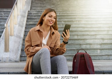 University student. Entrepreneur young. Mobile phone reading. Sitting outdoors. - Powered by Shutterstock