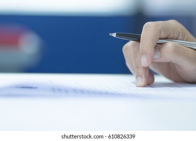 University Students Hand Testing Doing Examination With Blurred Abstract Background In Exam Classroom, Educational College