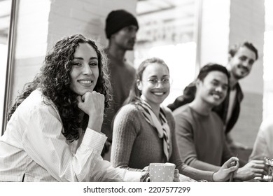 University students multiethnic team studying together  on a new project in creative coworking classroom - University concept - Bright filter with focus on first woman on left - Shutterstock ID 2207577299