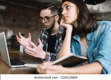 University Students Researching Information Online Using Laptop Computer, Studying At Library. Angry Man Failed Exam. Missed Deadline. Stress.   