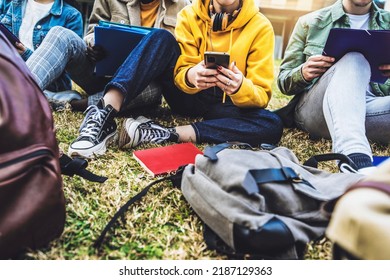 University Students Studying Together Sitting In College Campus - Group Of Teens Hanging Out In Public Park - High School And Millennial Generation Lifestyle Concept