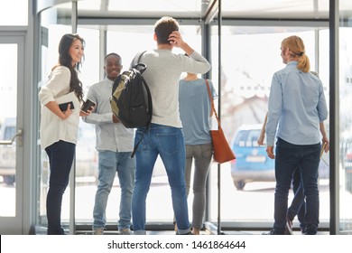 University Students Together In Entrance Making Small Talk