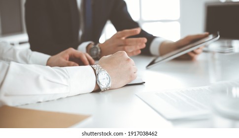 Unknown business people using tablet computer in modern office. Businessman or male entrepreneur is working with his colleague at the desk - Shutterstock ID 1917038462