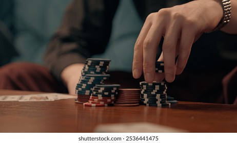 Unknown Caucasian business man guy businessman gamer male hand palm fingers touching counting poker chips tokens playing cards indoor living room or casino bar gambling game victory strategy addiction - Powered by Shutterstock