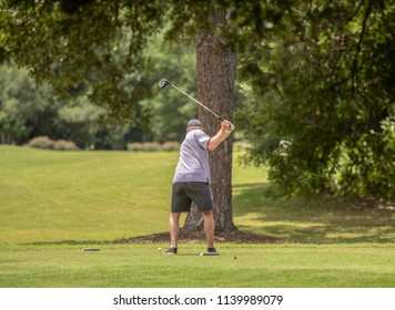 unknown golfer is first to tee off