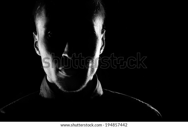 Unknown \
male person silhouette.Back lit studio\
isolated