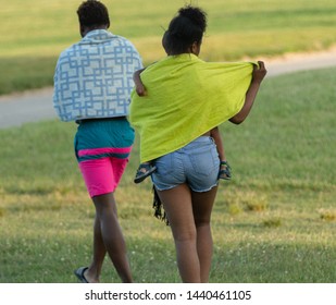 Unknown Mom Carries Her Boy To The Car After A Long Day