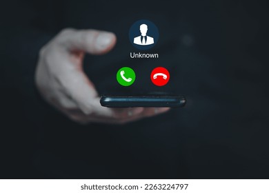 Unknown number calling in the middle of the night. Phone call from stranger. Man answering to incoming call. Phone call from unknown number. Call center gang, scammer or stranger. - Shutterstock ID 2263224797
