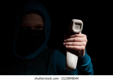 Unknown Person With Covered Face Makes An Anonymous Call Intimidating And Threatening The Interlocutor