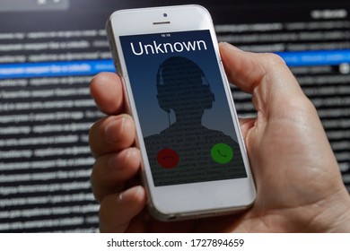 Unknown Unwanted Call To A Mobile Phone On A Dark Background