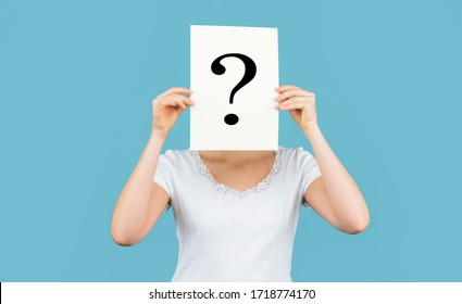 Unknown woman holding question mark. Girl holding paper question mark. Anonymous, woman question, incognita. Anonymous woman. Female incognita.Girl question, anonymous, incognita. 