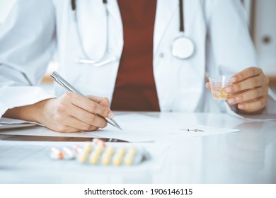 Unknown Woman-doctor Fills Up Prescription Form. Close-up. Panacea And Life Save, Prescribe Treatment, Legal Drug Store. Medicine Concept